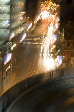 Blurred time-lapsed car headlights at night.